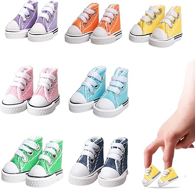 Mimilla 7 paires de mini chaussures à doigts, adorables mini chaussures de skate pour danser avec les doigts, chaussures de poupée elfe utilisées pour fabriquer des porte-clés et des baskets oiseaux. Chez DIAYTAR COTE D'IVOIRE, nous visons à vous offrir la plus grande sélection de produits en ligne, allant des électroniques aux produits de maison, en passant par la mode et bien plus encore, pour faciliter vos achats.
