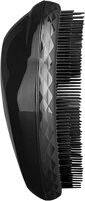 Brosse coiffante originale tangle teezer - panther black. DIAYTAR COTE D'IVOIRE, c'est l'opportunité de découvrir de nouveaux produits et de profiter de promotions exceptionnelles. Nous sommes fiers de proposer à nos clients une large gamme de produits de qualité, avec des prix compétitifs et des frais de livraison raisonnables. Notre équipe est à votre disposition pour vous aider à naviguer sur notre site et à trouver les produits qui vous conviennent.