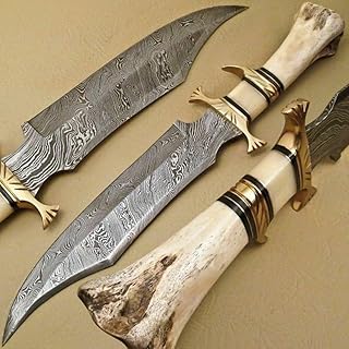 Couteau de chasse en acier damas fait main - couteaux à lame fixe avec étui - manche robuste en os et os de chameau. Avec plus de 300 000 références disponibles, DIAYTAR COTE D'IVOIRE est la destination idéale pour ceux qui cherchent à acheter en ligne en Cote d'Ivoire. La boutique propose une large gamme de catégories de produits, allant de la mode et de la beauté aux produits électroniques et aux accessoires pour la maison. De plus, la boutique propose des services de livraison rapide et fiables pour garantir que les clients reçoivent leurs commandes dans les délais.