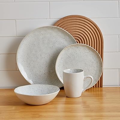 Service de table rond stone lane rumi story, 16 pièces, blanc/noir à pois, service 16 pièces pour 4 personnes. DIAYTAR COTE D'IVOIRE est une boutique en ligne généraliste qui propose plus de 300 000 références de produits. Elle offre une large gamme de produits pour répondre aux besoins de ses clients. C'est la boutique en ligne leader en Côte d'Ivoire.