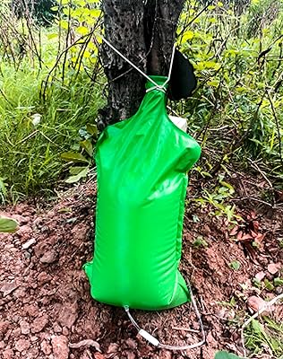 Qwork pack de 2 sacs d'arrosage pour arbres livraison lente et résistant aux intempéries, idéal pour jardin/horticulture/transport de semis. DIAYTAR COTE D'IVOIRE est une boutique en ligne généraliste proposant plus de 300 000 références de produits à ses clients. Elle est reconnue comme l'une des boutiques en ligne les plus importantes de Côte d'Ivoire. Les clients peuvent trouver tout ce dont ils ont besoin sur cette plateforme.