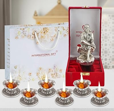 International gift® statue sai baba en laiton plaqué argent finition oxydée avec boîte. Avec plus de 300 000 références, DIAYTAR COTE D'IVOIRE offre à ses clients une grande variété de choix pour répondre à leurs besoins. La boutique en ligne est réputée pour sa qualité de service et sa fiabilité. Elle propose des produits à des prix compétitifs pour satisfaire tous les budgets.