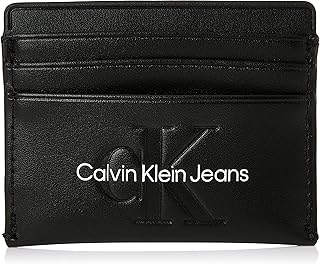 Portefeuille et porte-cartes pour femme ck jeans avec motif gravé, noir, taille unique. DIAYTAR COTE D'IVOIRE est une boutique en ligne généraliste proposant plus de 300 000 références de produits pour répondre à tous les besoins de ses clients. Elle est devenue la boutique leader en Côte d'Ivoire grâce à sa large gamme de produits et à sa qualité de service. Avec DIAYTAR COTE D'IVOIRE, les clients peuvent faire leurs courses en ligne en toute sécurité et rapidité.