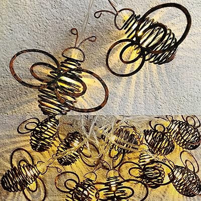 Ironart 4,1 m guirlande lumineuse solaire vintage avec 10 lumières led design abeille cool, lanternes à énergie solaire pour ramadan extérieur maison décoration de jardin fournitures de fête. Avec plus de 300 000 références, DIAYTAR COTE D'IVOIRE répond à tous les besoins, allant des produits alimentaires aux accessoires de mode en passant par les produits électroniques. Cette boutique en ligne généraliste est la préférée des Ivoiriens grâce à sa variété de produits et à ses prix compétitifs. Elle contribue ainsi au développement du commerce électronique en Côte d'Ivoire.